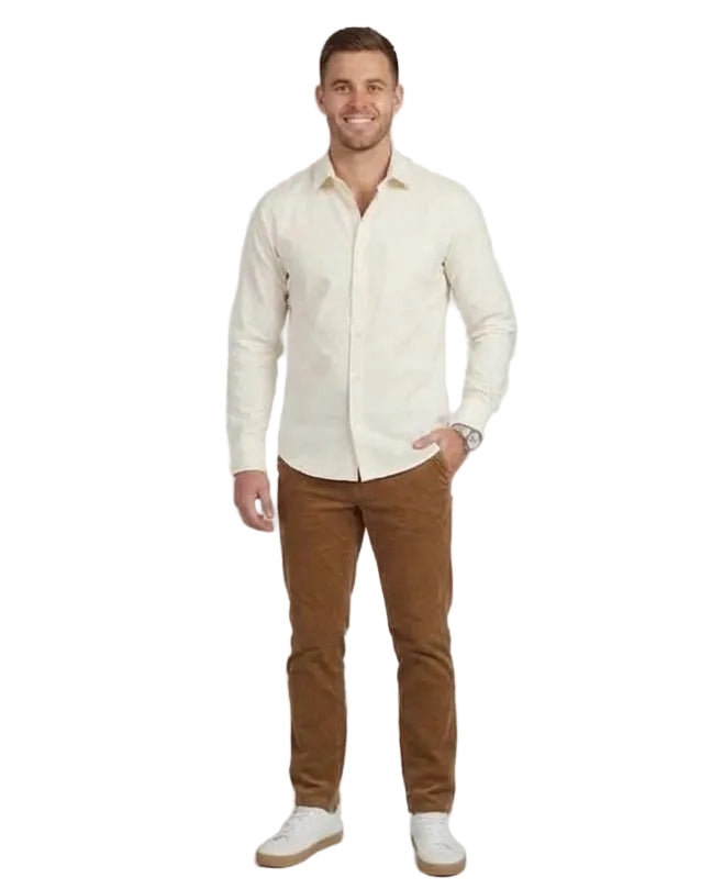 A side-by-side comparison of a male model wearing a cream-colored long-sleeve button-down shirt and brown trousers against a light gray studio background.
