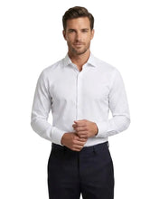 Load image into Gallery viewer, A man wearing a white long-sleeve dress shirt and dark trousers, standing against a plain light gray studio background.