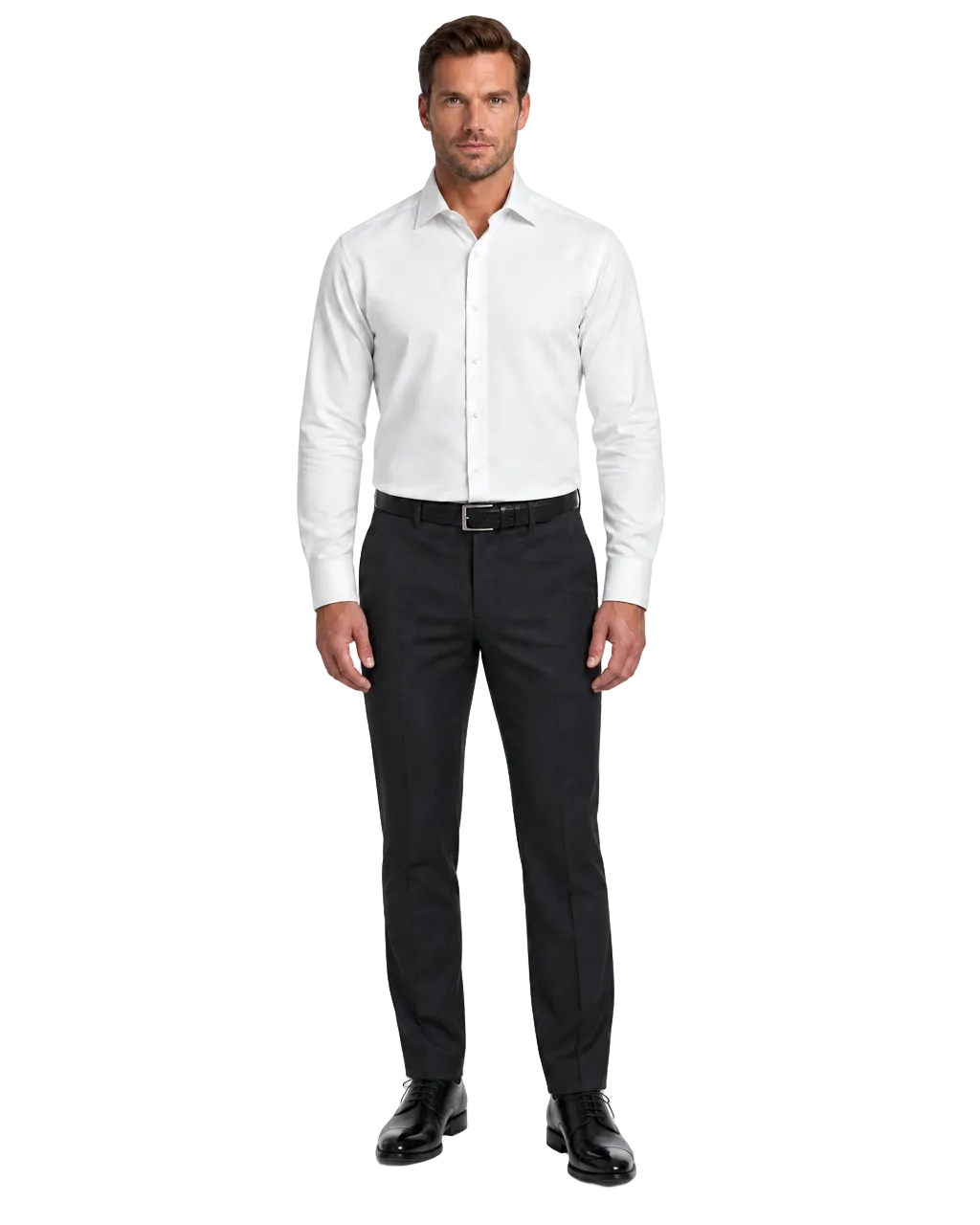 A man modeling a white long-sleeve dress shirt and dark charcoal trousers with a black belt and black dress shoes, photographed against a plain white studio background.