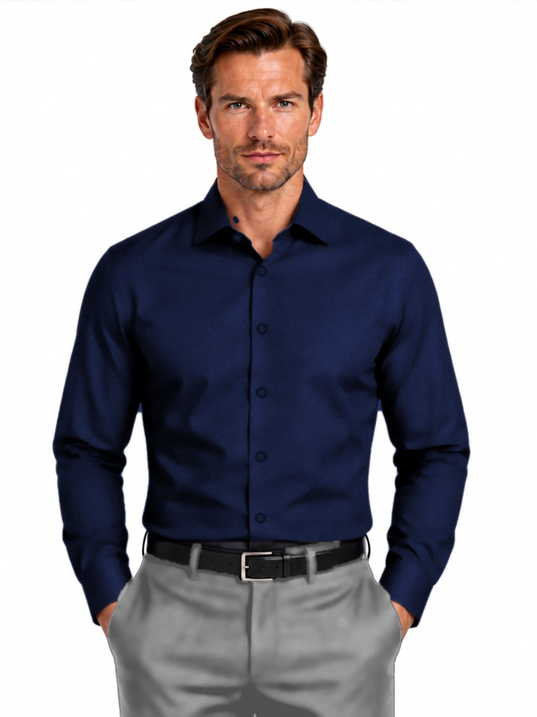 A man wearing a dark navy blue long-sleeve button-down shirt and light gray dress pants, standing against a plain white background.
